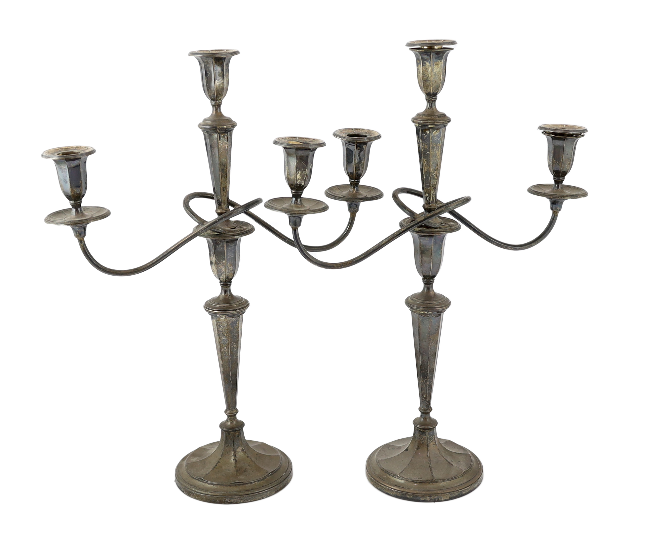 A pair of George V silver two branch, three light candelabra, by Eugene Leclere